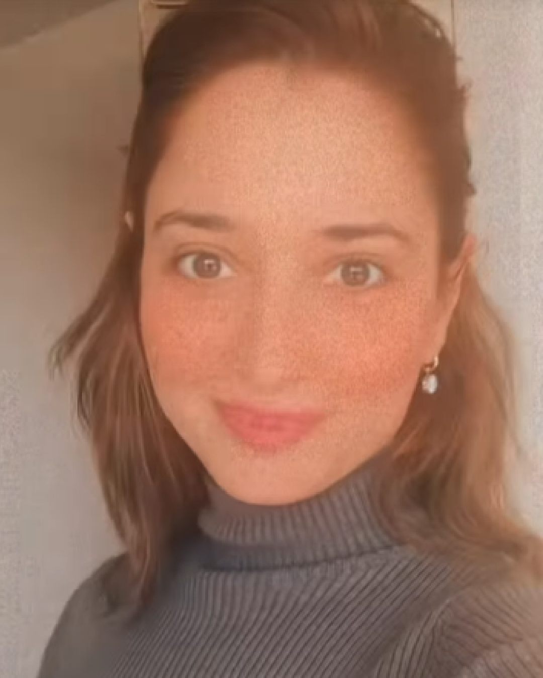 Tamannaah Bhatia shared a video from a skyscraper in Dallas, Texas. The actress sported a grey turtleneck sweater in the clip. 