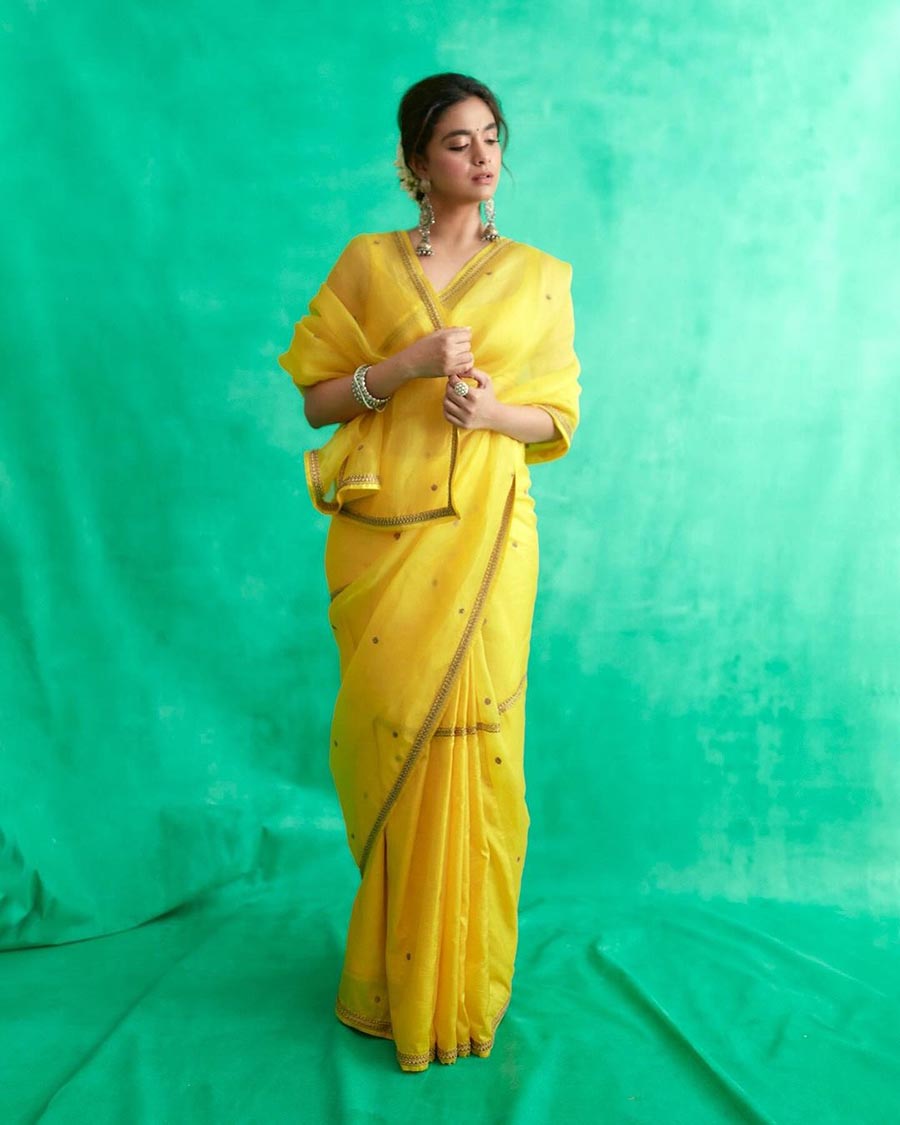 Keerthy Suresh picked this sunshine yellow sheer sari and oversized danglers for a special occasion. ‘New Beginnings and Yellow,’ the Bhola Shankar actress captioned her pictures.