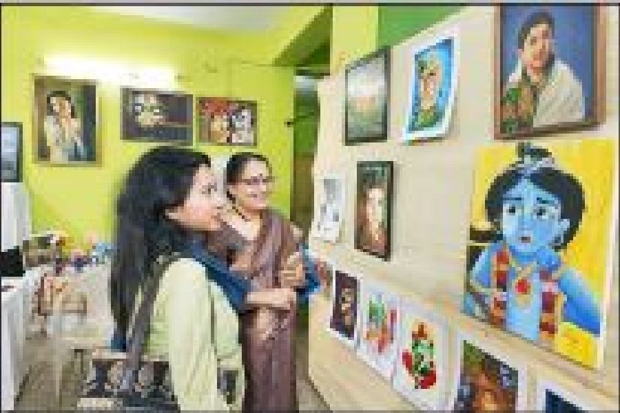 A visitor admires paintings at the CK Block exhibition
