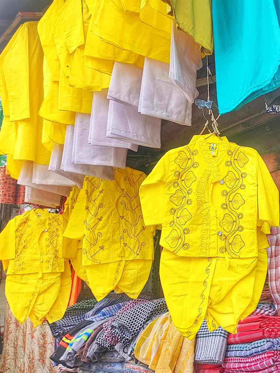 Yellow kurtas and sarees for children on sale at north Kolkata ahead of Saraswati Puja which will be celebrated on February 14 this year 