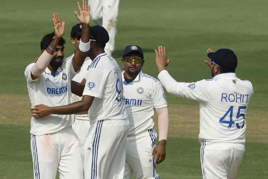 India's Jasprit Bumrah celebrates with Rohit Sharma and teammates after taking the wicket of England's Tom Hartley to win the second Test.