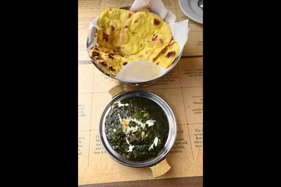 Saag Gosht with Makki ki Roti: Adding a non-vegetarian twist to the regular sarson da saag, is this variant that has succulent pieces of mutton in it. A variety of winter greens lend it a bright colour.