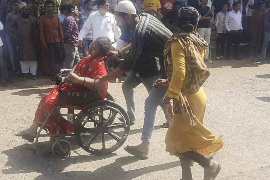 An injured being shifted to a hospital after a massive fire broke out in a firecracker factory in Harda town.