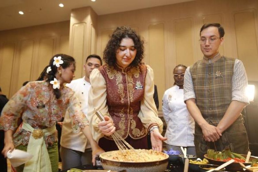 Leyla Valiyeva mixes hummus at a competition in the 10th International IIHM Young Chef Olympiad