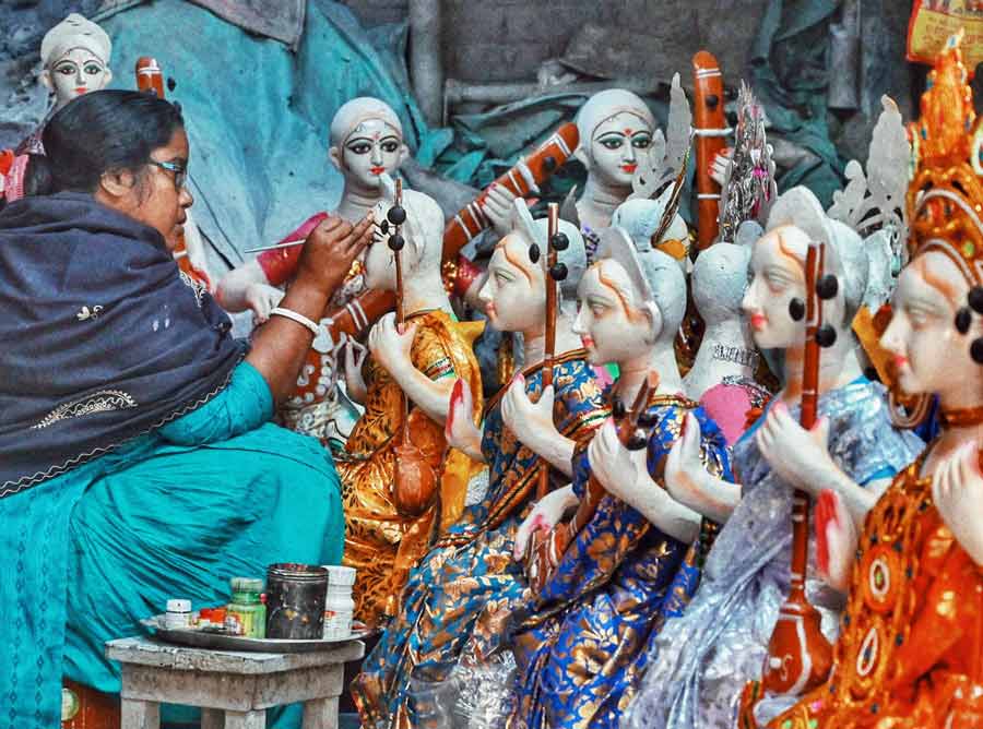 An idol-maker adds finishing touches to a Saraswati idol at Kumartuli on Thursday. This year, Saraswati Puja will be observed on February 14