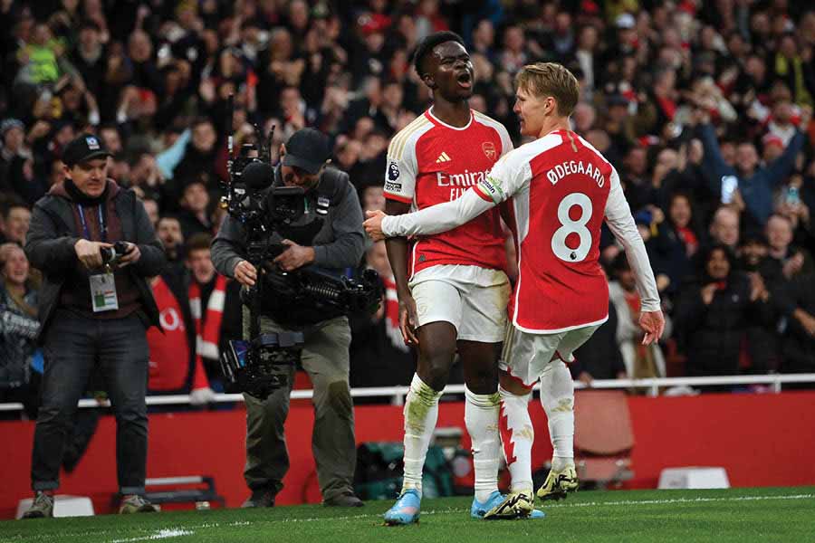 Bukayo Saka and Martin Odegaard celebrate during Arsenal’s encounter against Liverpool at the Emirates Stadium on February 4