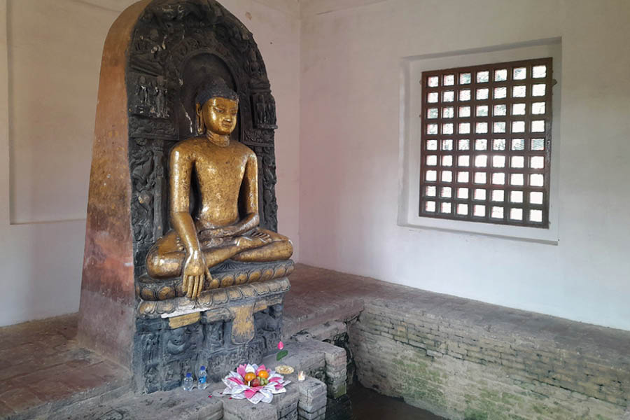 A golden statue of Buddha at the Matha Kuar Shrine