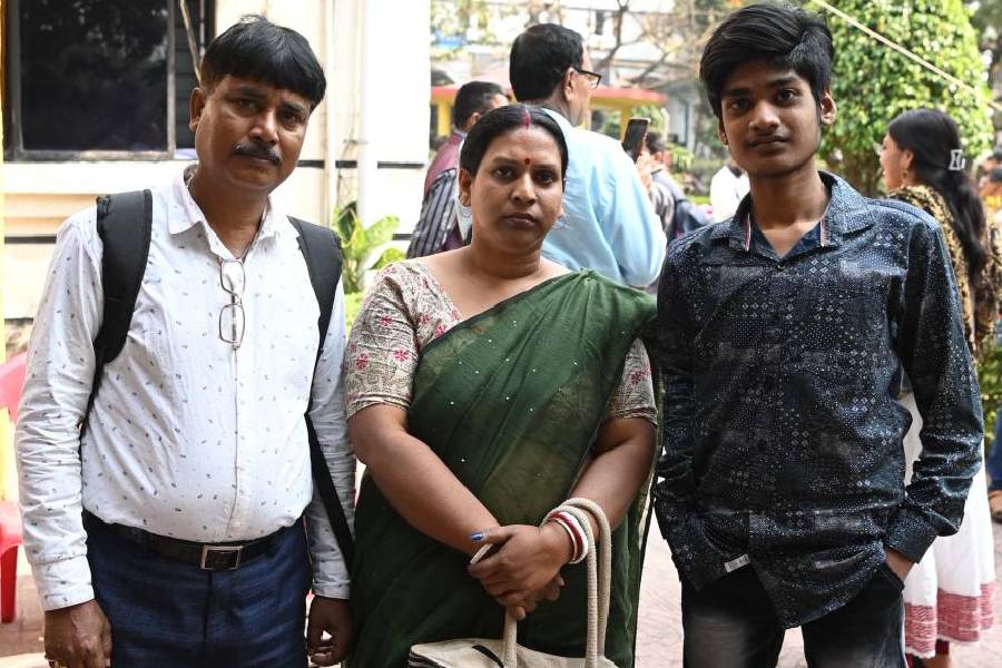 Monojit Das (right), who has undergone spine surgeries, with his parents on Sunday