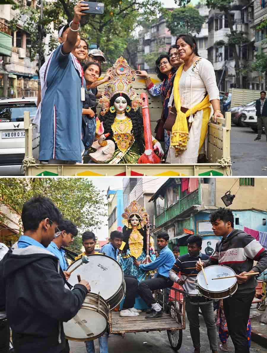 School students and staff carried Saraswati idols to their school from Kumartuli   