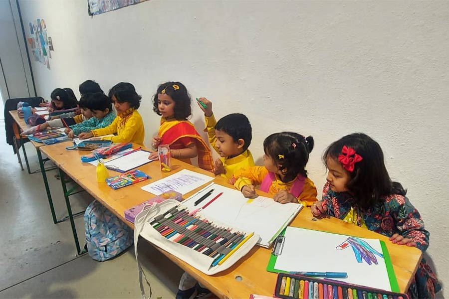 Children participating in a drawing competition at the puja in Munich