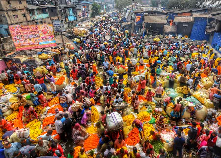 Mullick Ghat flower market was buzzing with buyers and sellers as the demand for flowers peaked a day ahead of Saraswati Puja   