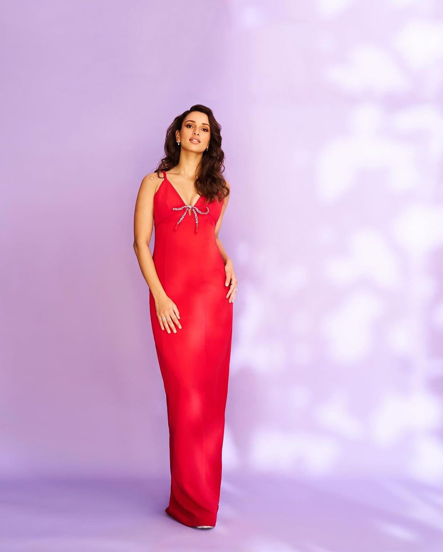 Triptii Dimri stole the show in a red column gown featuring a plunging neckline and a sequined bow. 