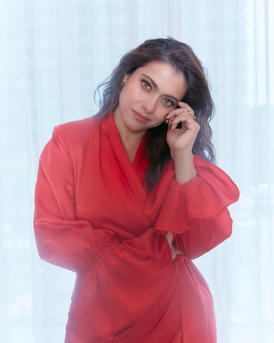 Kajol’s red wrap dress featuring flute sleeves was a winner. Nude makeup and minimal gold jewellery balanced the look.  