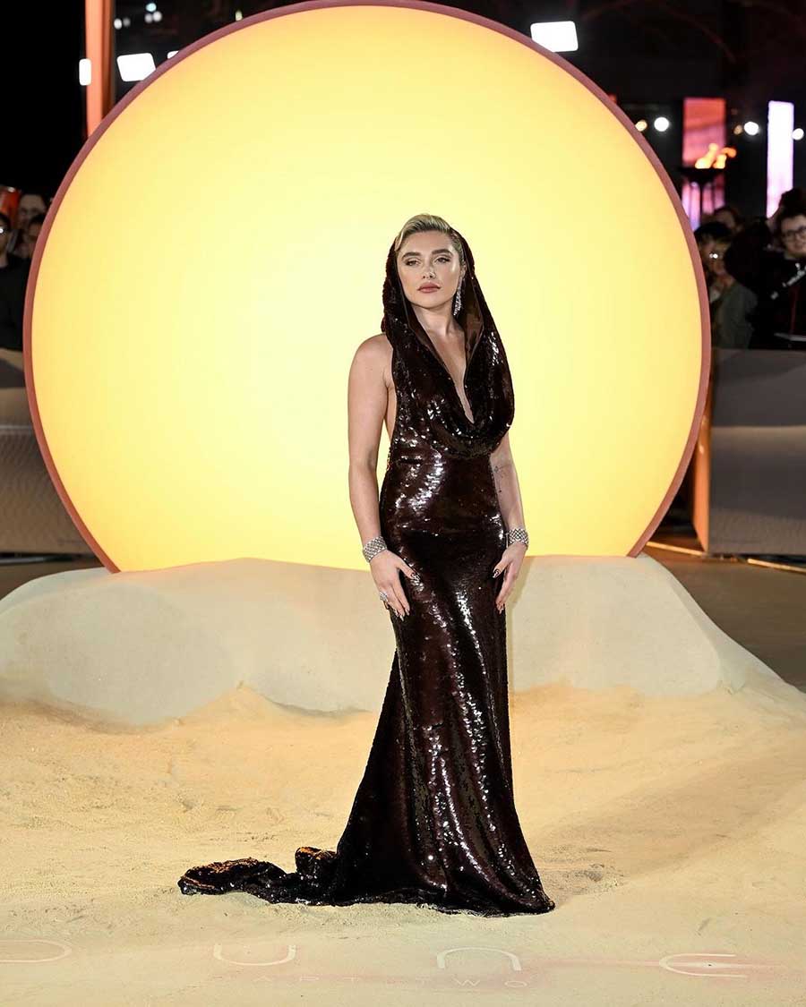 Florence Pugh, set to appear as Princess Irulan in Dune: Part Two, turned heads in a glittery black hooded gown with a plunging neckline.  