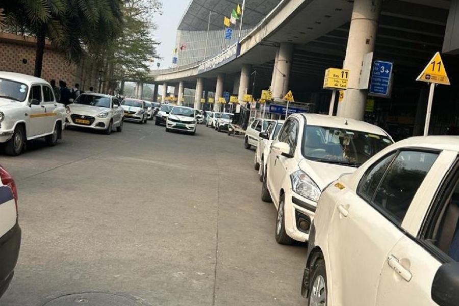 Cars at the spot designated for app cabs at the airport on Friday.