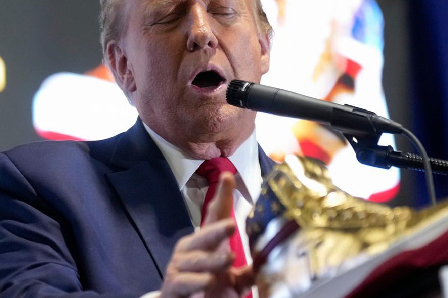 Donald Trump was met with mixed reception as he presented his 'Never Surrender High-Tops' at Pennyslvania's 'Sneaker Con' event