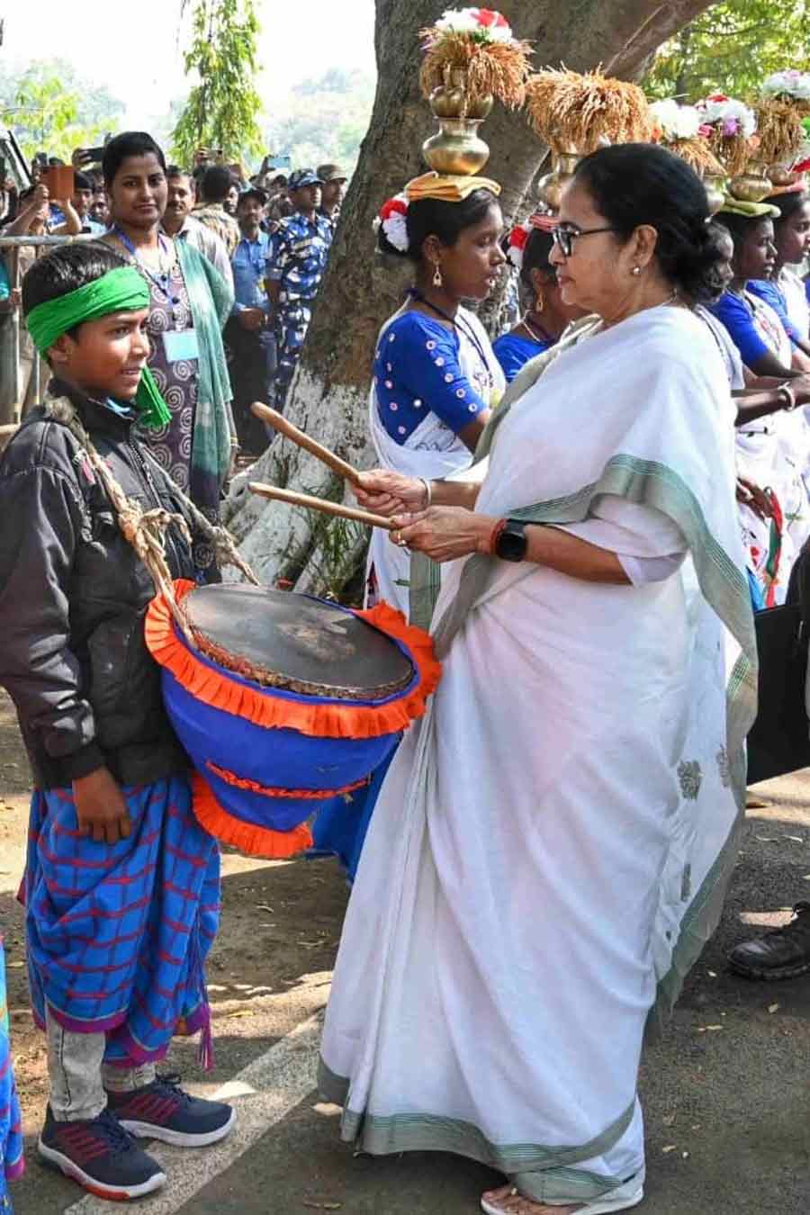 Chief minister Mamata Banerjee tries her hand at playing the joins the tribal community to play the ‘dhamsa’ on a visit to Birbhum  