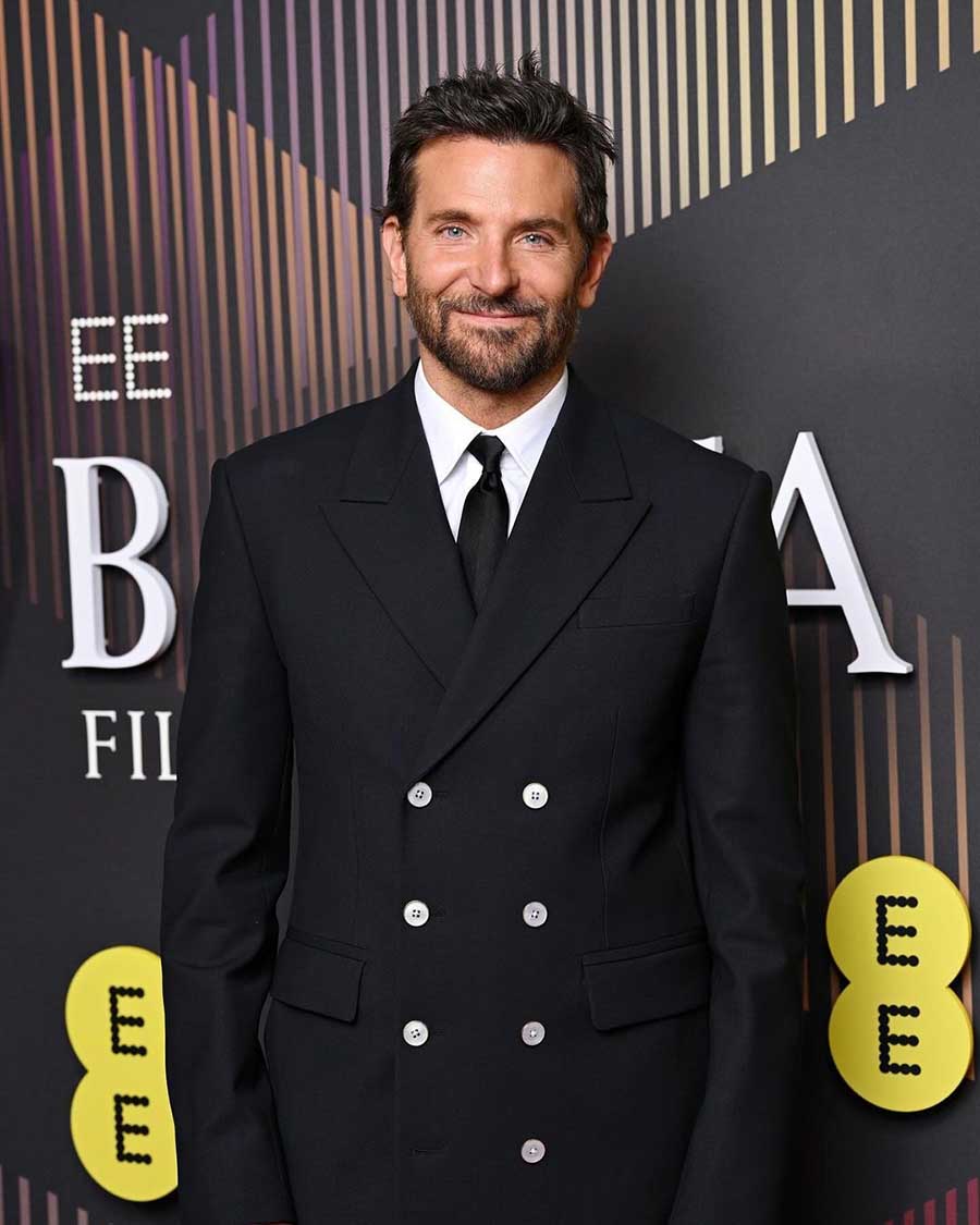 Actor-filmmaker Bradley Cooper opted for a double-breasted black suit.
