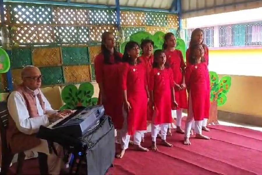 The choir, with their trainer Anjan Raichaudhuri, performs for the elderly residents of Alzheimer’s & Related Disorders Society of India, Calcutta chapter, in Santoshpur last week.