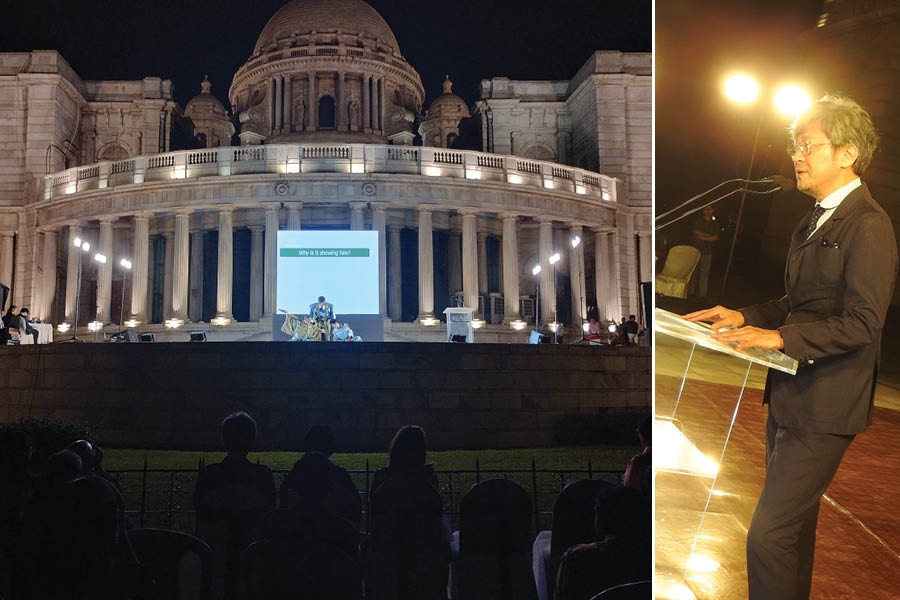 Victoria Memorial Hall glows during the performance and (right) consul general of Japan Nakagawa Koichi addresses the audience
