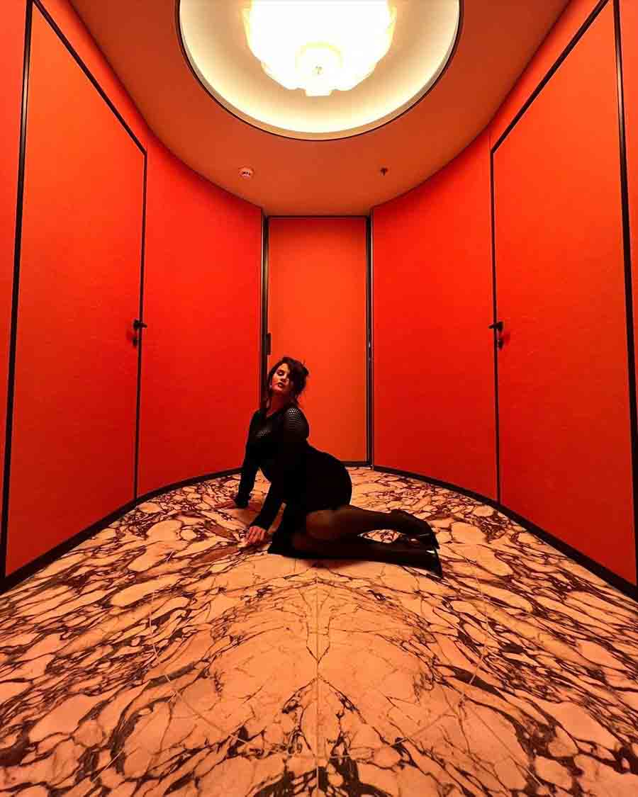 The actress, whose Only Murders in the Building Season 3 will release this year, oozed glamour in an all-black outfit in a red room with marble floors.