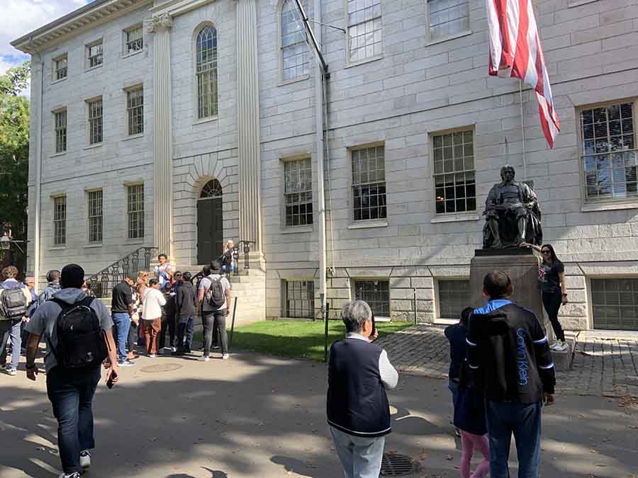 I came across a few tours — guided by students — at the Cambridge campus of Harvard University. Here, is a group by the steps while on the right is a statue of John Harvard, the first major benefactor of the university
