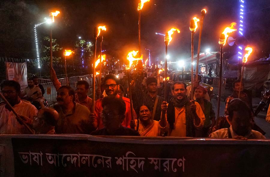 Hundreds of people walked in a torch rally near the Academy of Fine Arts on Tuesday midnight to mark Bhasha Divas on Wednesday