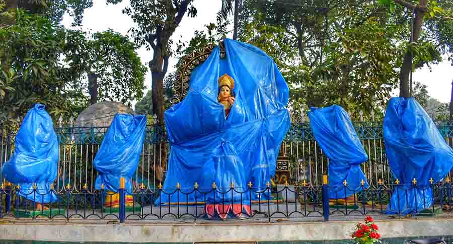 Statues wrapped in polythene as part of a beautification drive at Jagat Mukherjee Park in Bagbazar on Wednesday await inauguration 