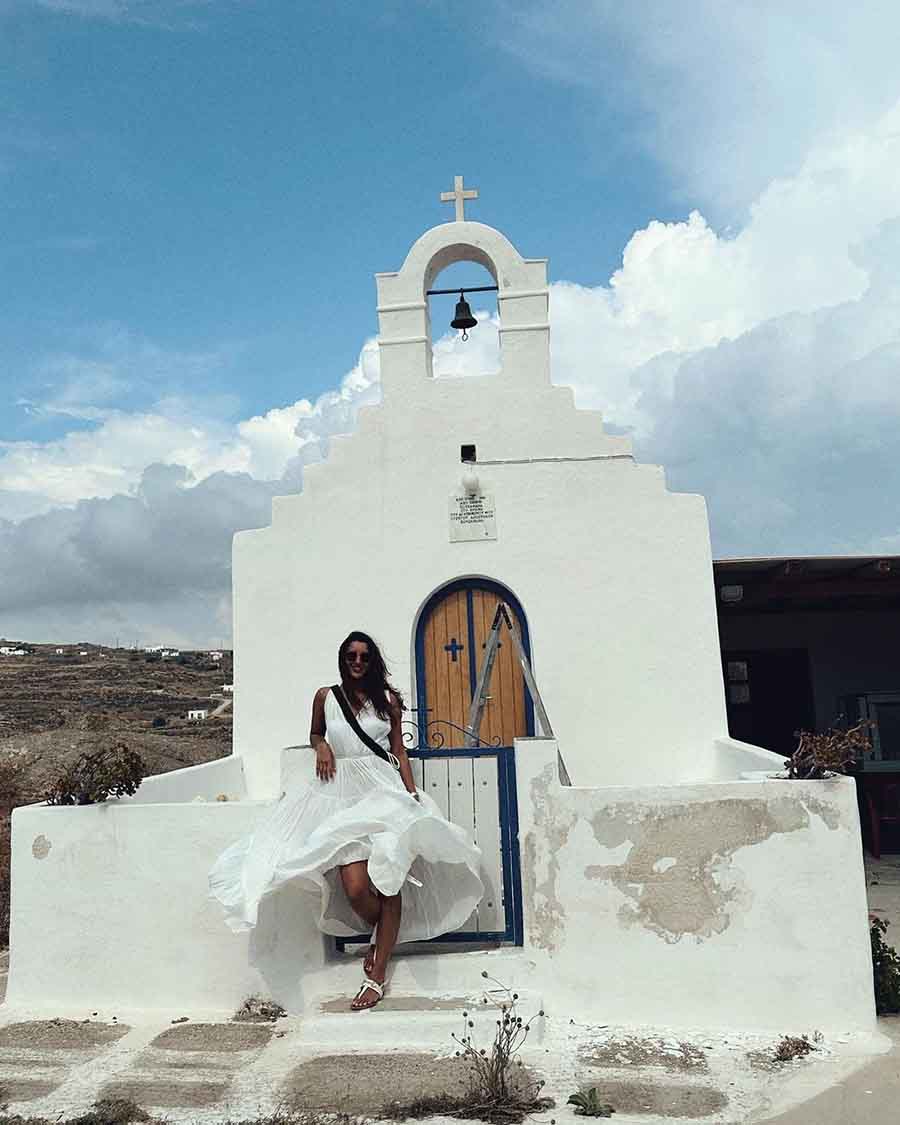 Triptii, looking gorgeous in a flowy white dress, had her own Marilyn Monroe moment on a particularly windy day while she felt all touristy in Greece.  