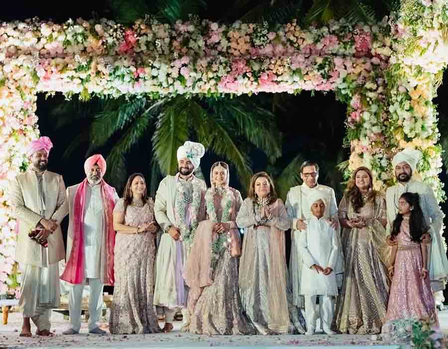 The newlyweds posed for a family portrait after the ceremony. 