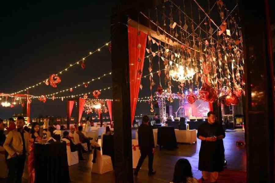 Festive streamers, a grand chandelier and Valentine’s Day-themed party props created an enchanting atmosphere