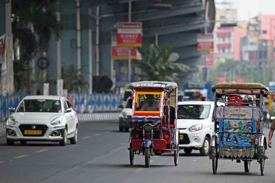 Totos and (below) a cycle van near the Baguiati crossing on VIP Road on Sunday