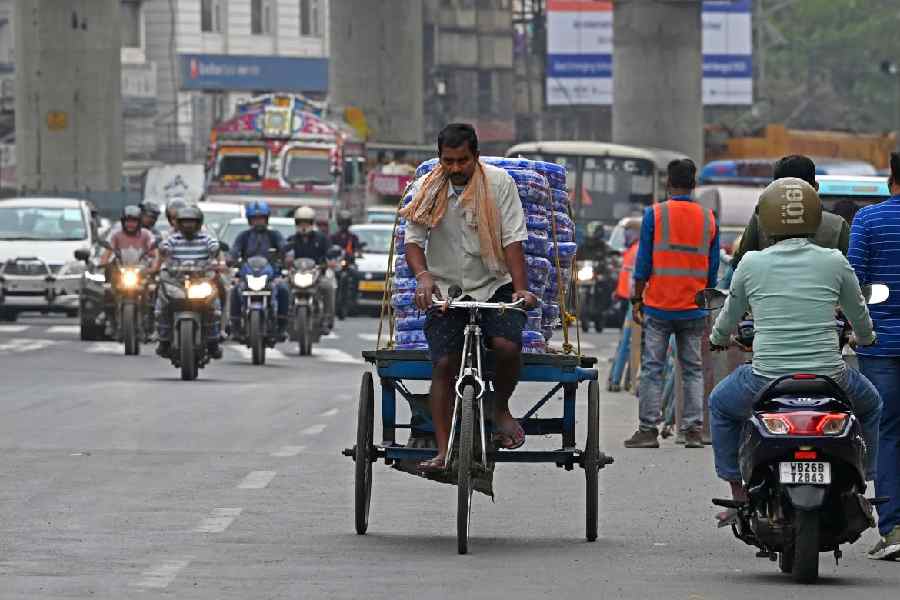 A tricycle van runs on VIP road at Kaikhali area on Sunday, February 25, 2024