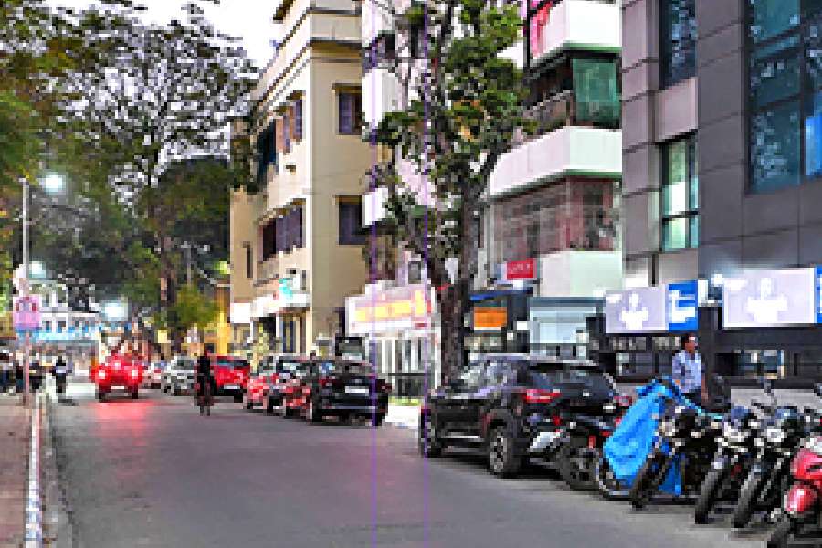 Vehicles parked on Motilal Nehru Road, near Priya cinema, on Monday. The parking attendant was 1 arrested on this stretch.