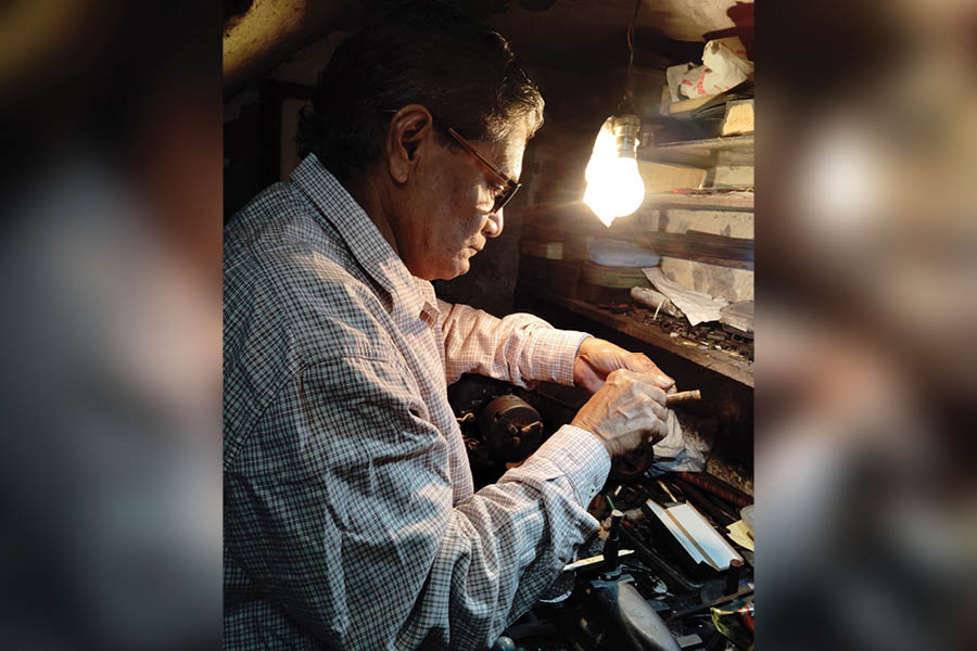 Dilip Basak engrossed in his craftsmanship at his Debendra Ghosh Street shop in Bhowanipore