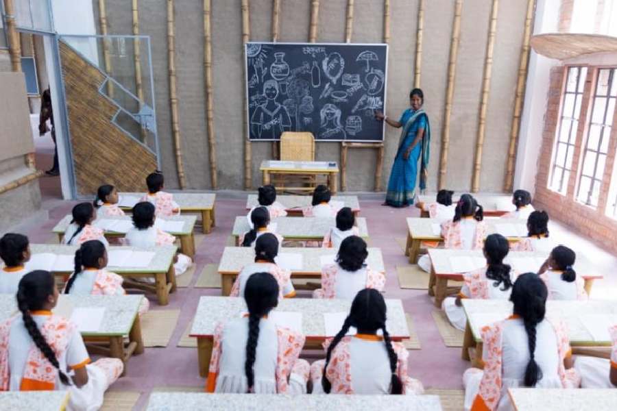 Girls attend a class at Adhigam Bhoomi, the learning centre in Joka
