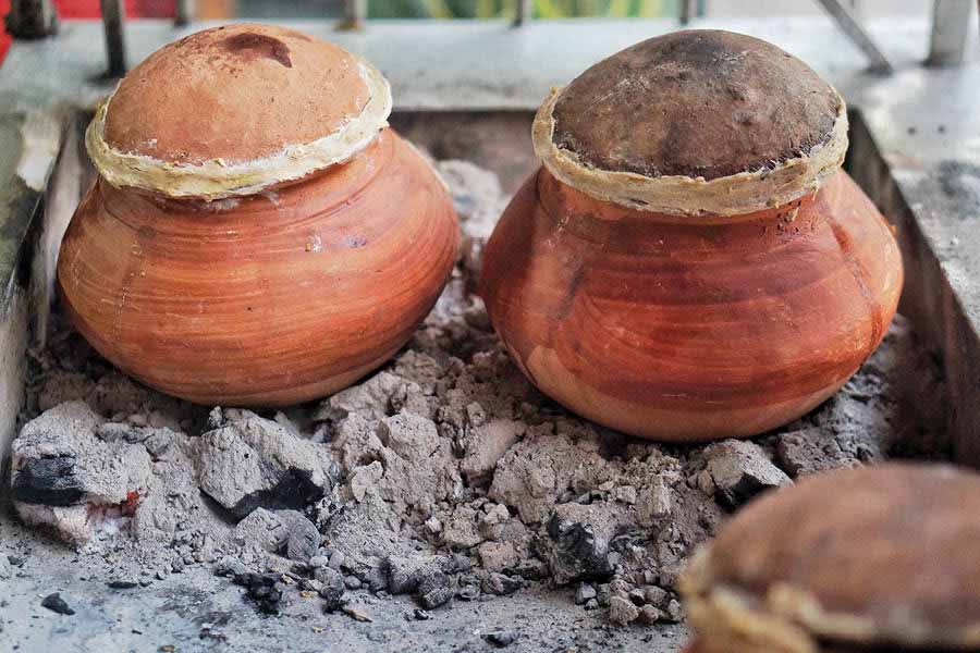 Simple sealed clay pots are used to slow cook the meat for the Bihari Ahuna 
