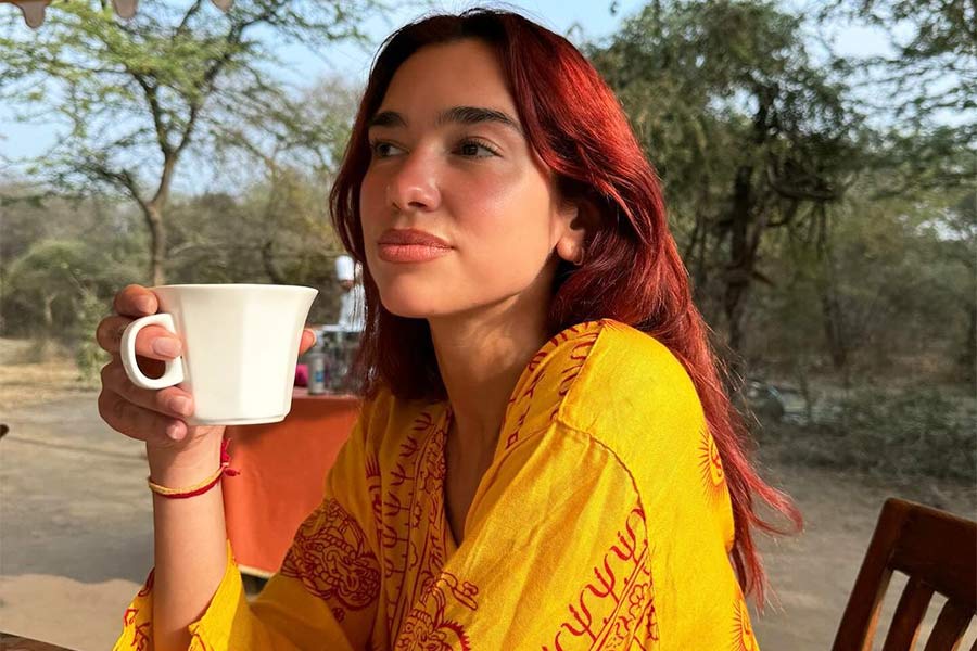 In the first picture, the Levitating singer sported a yellow Rajasthani kurta and held a tea cup in her hand.