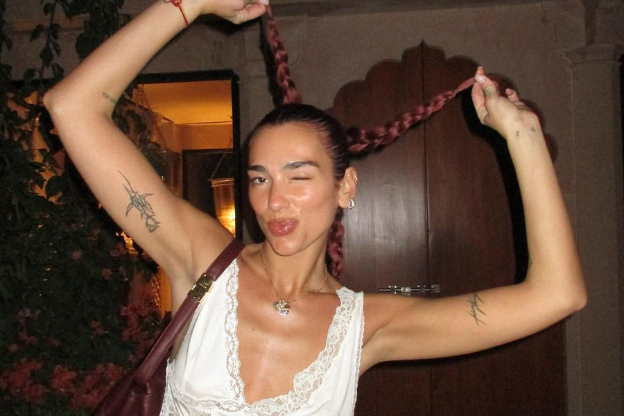With her red braided hair and nude makeup, Dua looked stunning in a V-neck crop top.
