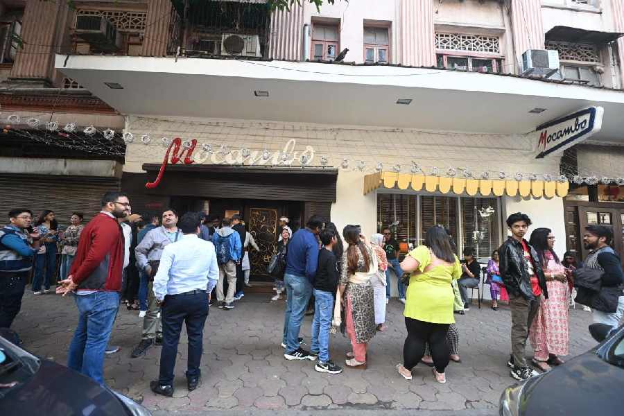 Diners wait for their turn to enter Mocambo on Park Street on Monday afternoon.