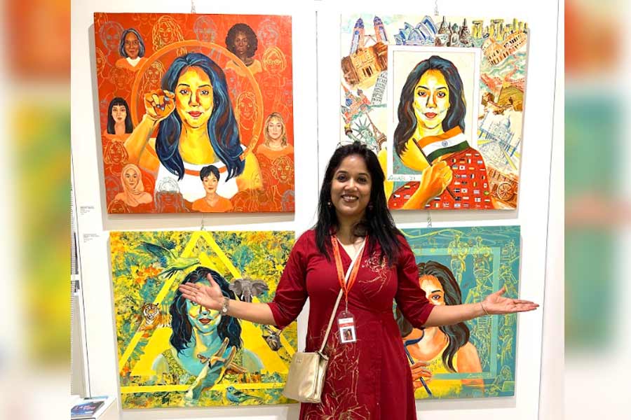 Anukta Mukherjee Ghosh with the four paintings of hers that featured at the exhibition at the Florence Biennale in October