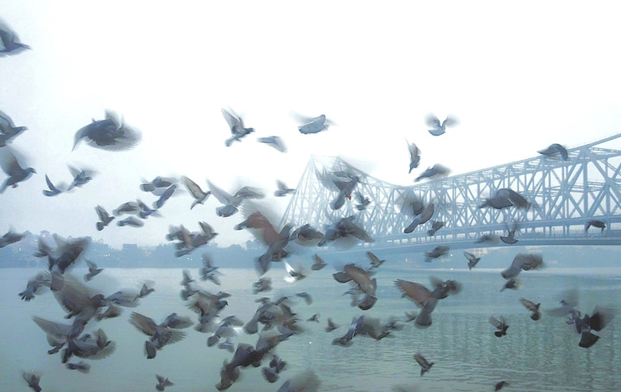 Howrah Bridge enveloped in fog during the early hours on Tuesday   