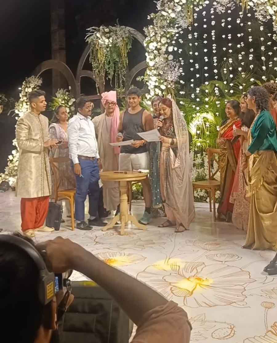 Ira and Nupur exchanged wedding vows against a floral background in the presence of their loved ones, including Aamir and Kiran. 