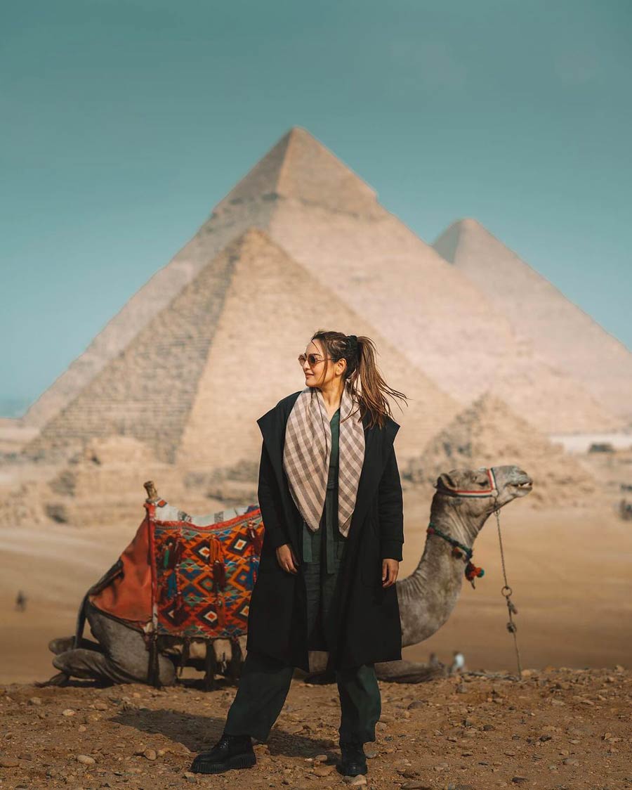 The 36-year-old actress, who earned plaudits for her performance in the 2013 movie Lootera, also posed with a camel in front of the Great Pyramid of Giza. She paired an olive green jumpsuit with a long black overcoat and black boots. 