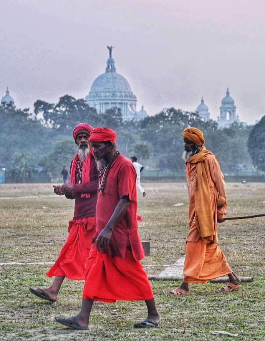 Sadhus who have arrived in the city for Gangasagar Mela take a stroll at Maidan on Friday afternoon   