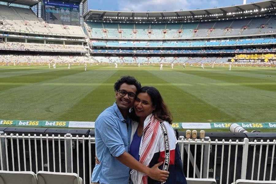 The author (left) with his partner at the Melbourne Cricket Ground (MCG) for the Boxing Day Test between Australia and Pakistan