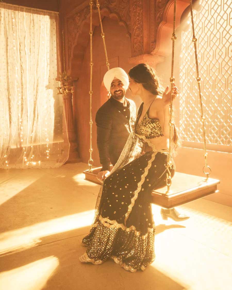 Mouni shared a candid shot of her and Diljit sitting on a swing from the set of Love Ya.