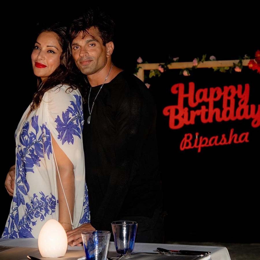 Karan, looking dapper in a black outfit, posed for a romantic photograph with the birthday girl.  