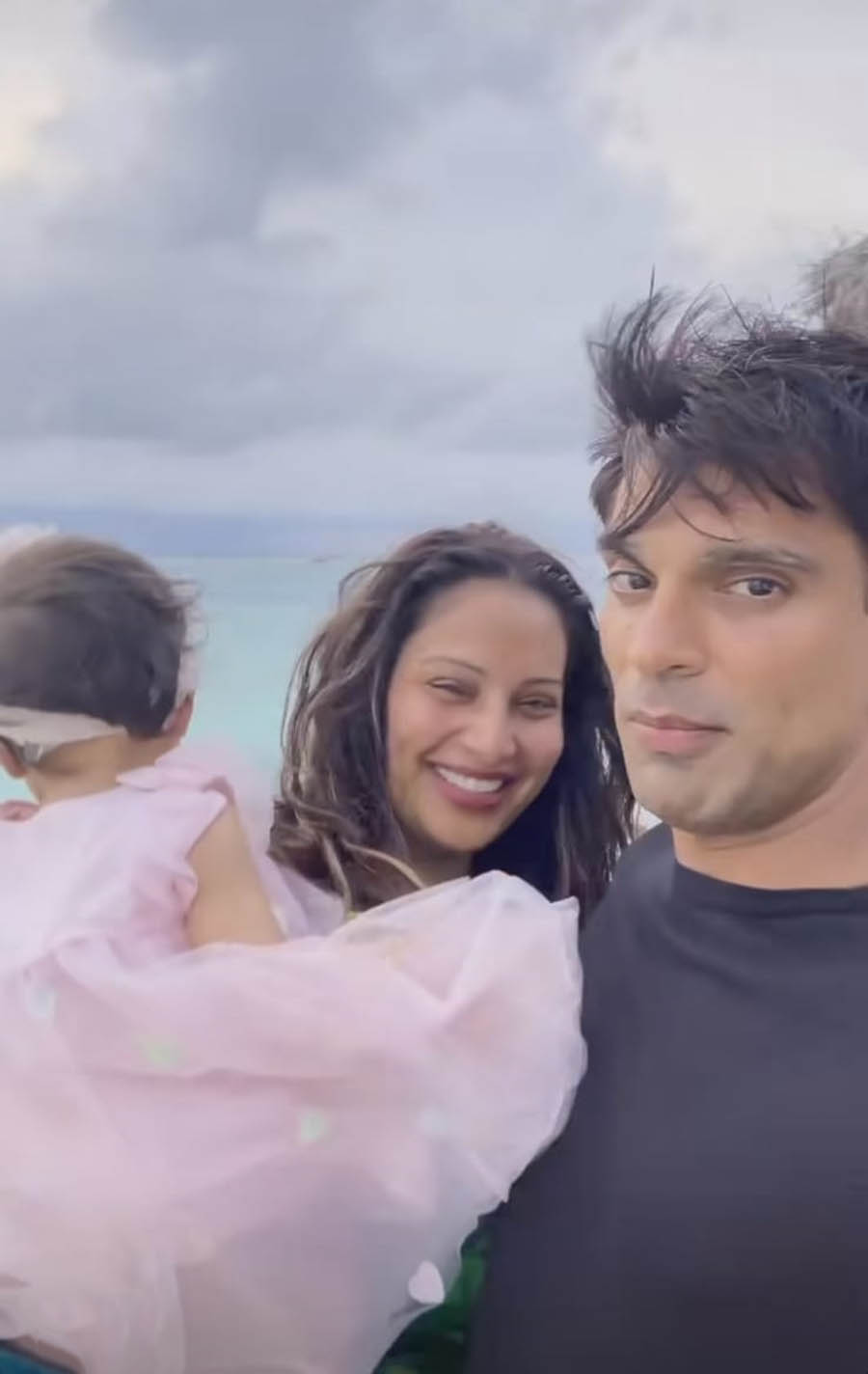 Sharing a video of her, Karan and Devi enjoying the light breeze by the sea, Bipasha wrote, “Thankful.” 