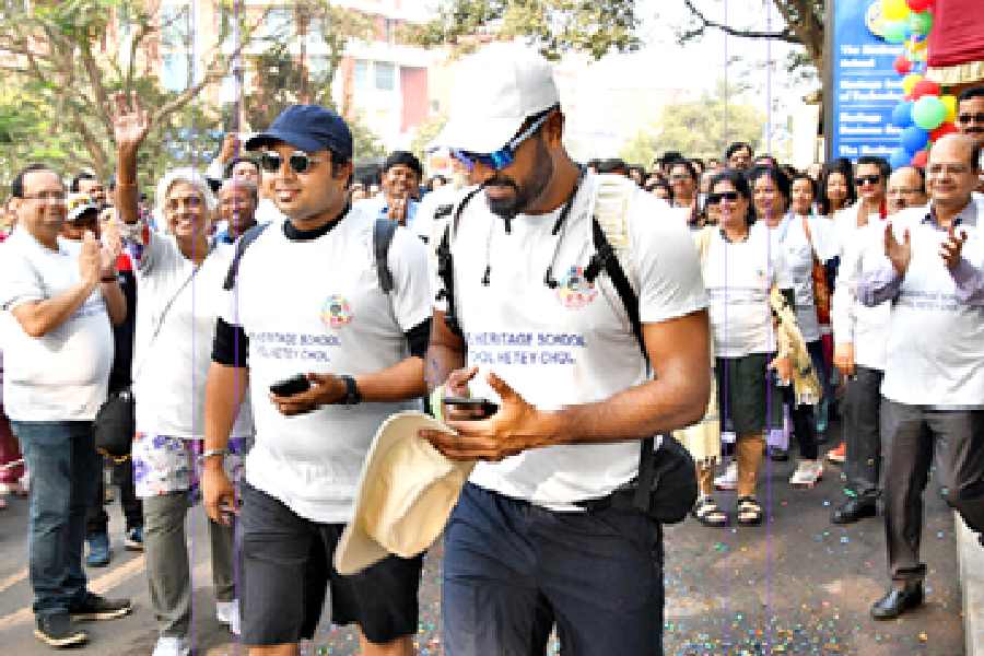﻿Sourav Dutta and (right) Akash Basu, The Heritage School teachers, in the 'Chol Hetey Chol' walk on Monday afternoon.